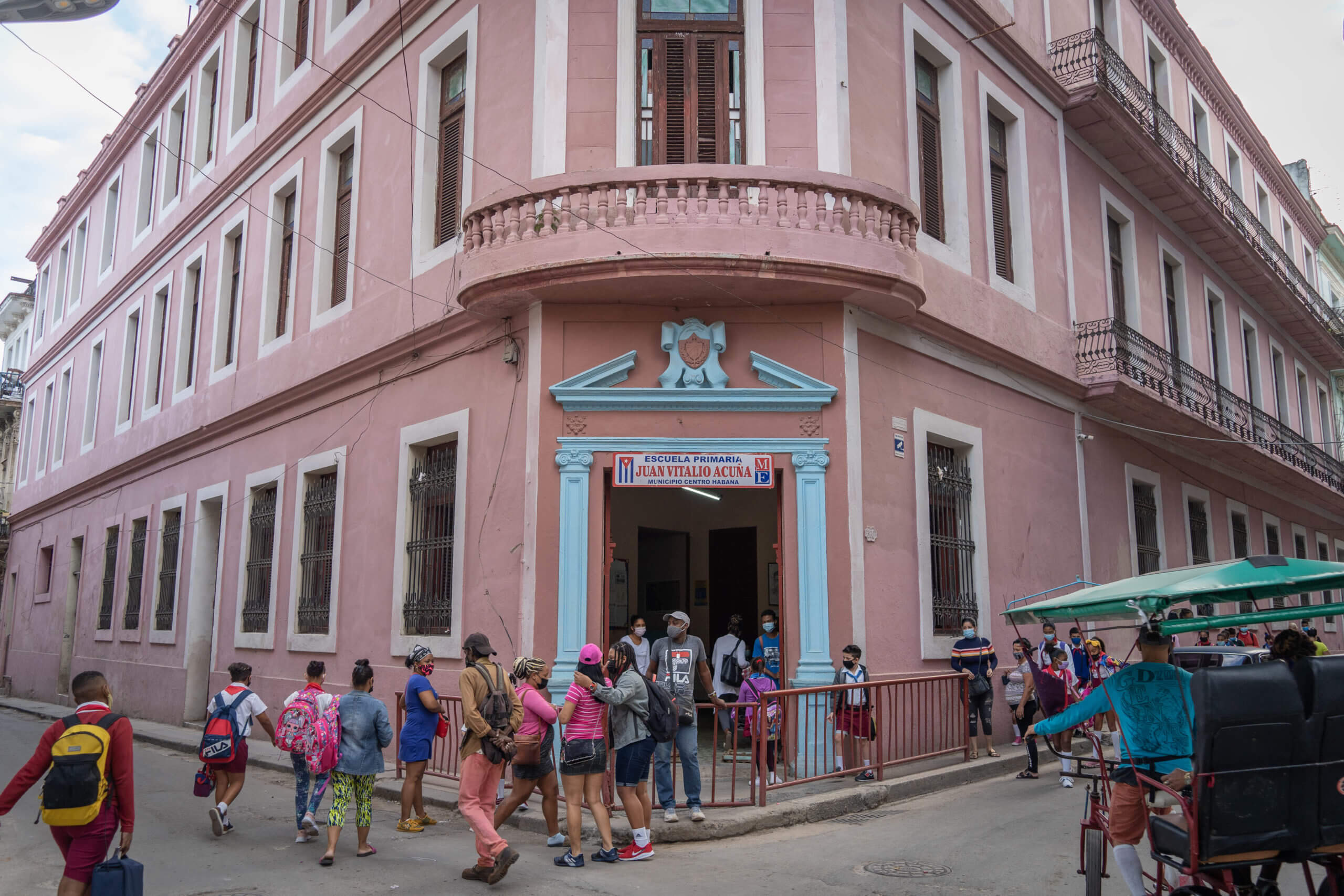 Middle school in the Habana Centro district of the Cuban capital arrive early in the morning to start classes. There is universal and free education on the island nation and illiteracy was wiped out since the 1960s as a result. © 2022 John D. Elliott • www.TheHumanPulse.com
