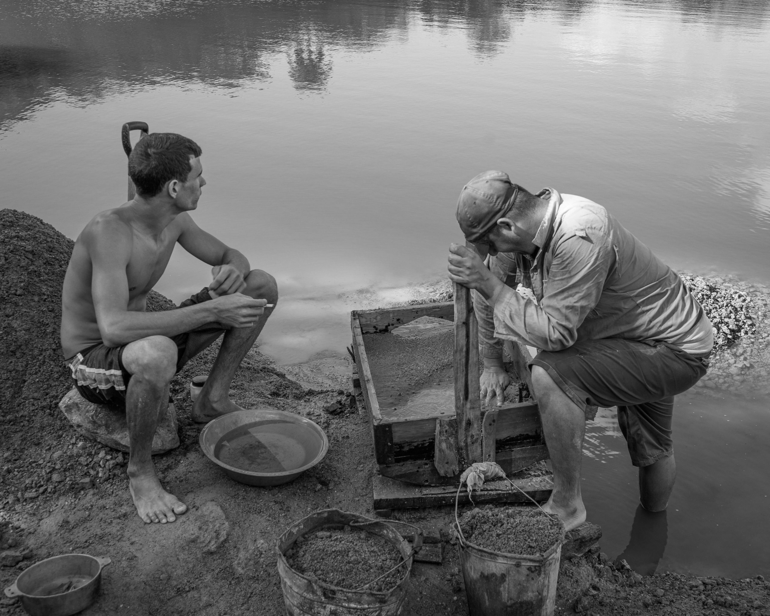 Two petty gold miners pause in their labors at an informal mine near Holguín, Cuba. © 2022 John D. Elliott • www.TheHumanPulse.com