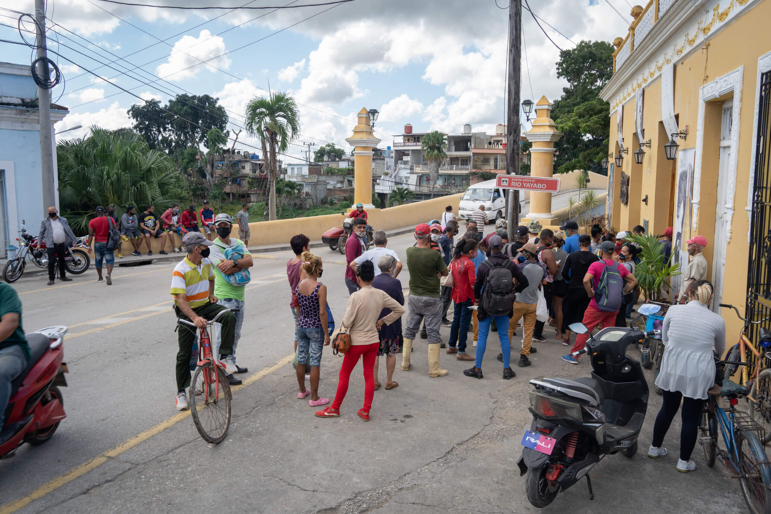 Most Cubans – except a small minority of elites – must queue up for hours each week in order to receive even the basic commodities. Penitents outside the Church of San Lazaro near Havana. © 2022 John D. Elliott • www.TheHumanPulse.com