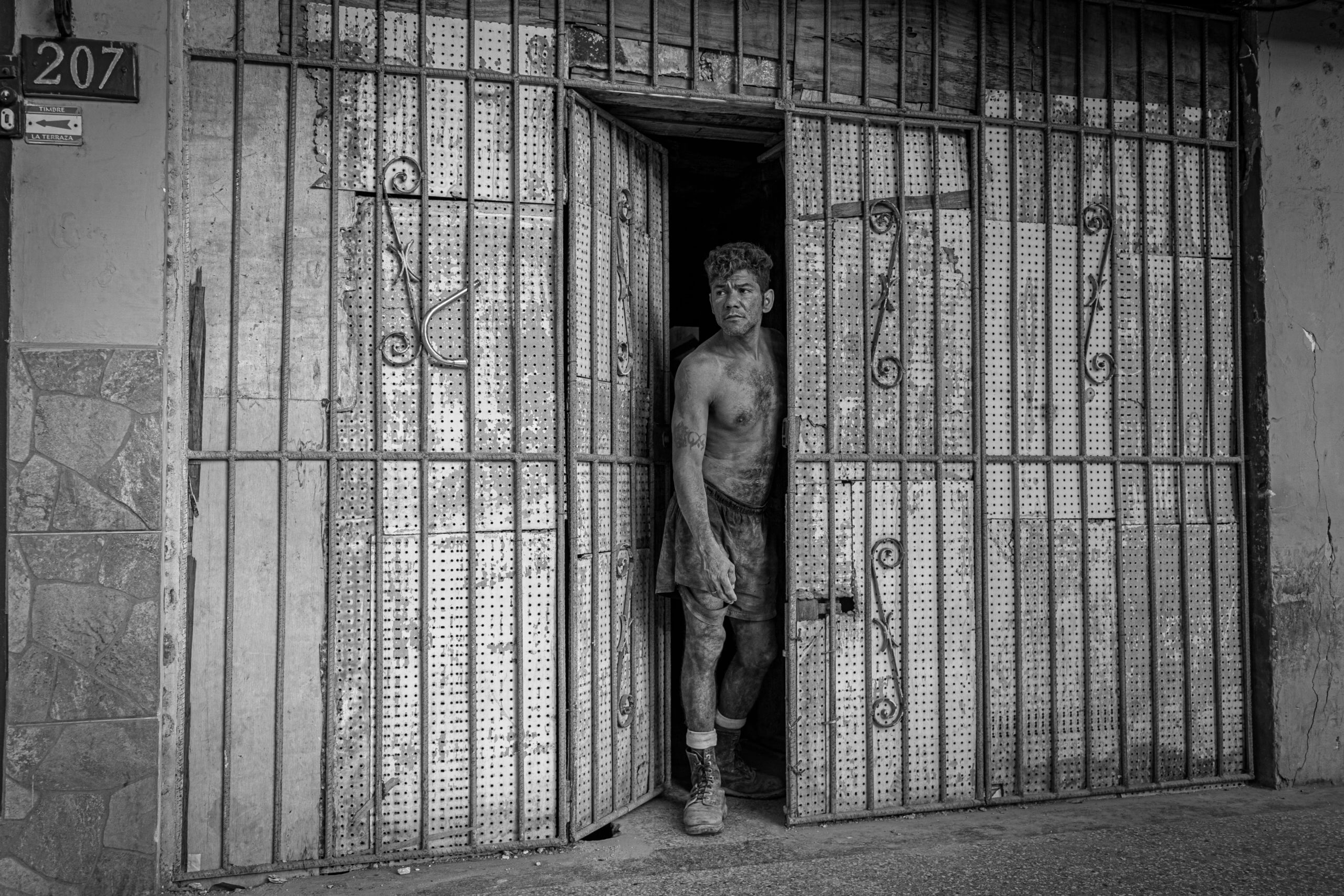 A mason scrutinizes the area outside a house he is remodeling in the Habana Centro district of the island nation's capital. © 2022 John D. Elliott • www.TheHumanPulse.com