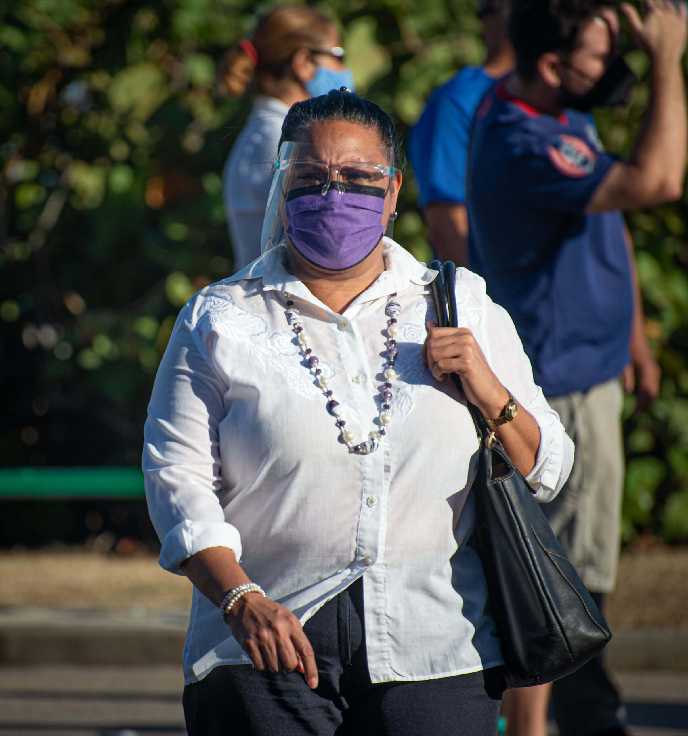 Some Cubans, such as this woman in Havana, take additional precautions in the face of the COVID-19 pandemic crisis. © 2022 John D. Elliott • www.TheHumanPulse.com